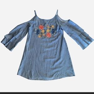 90% cotton chambray dress with embroidered floral hummingbird detail and ruffle